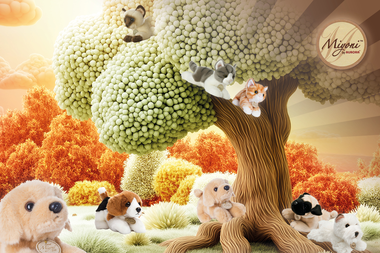 Katzen- und Hundeplüschtiere auf der Wiese