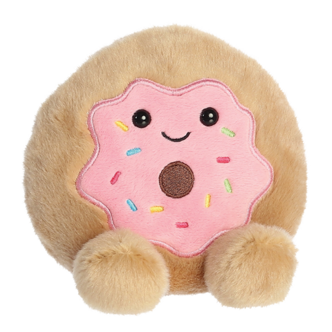 Kuscheliges Plüschtier in Form eines Donuts mit rosa Zuckerguss und bunten Streuseln, mit kleinen Füßen und einem lächelnden Gesicht.