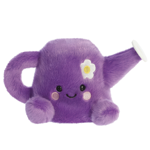 Lila Gießkanne aus Plüsch mit einem lächelnden Gesicht und einer Blume auf der Seite.