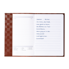 Ein offenes Notizbuch mit handschriftlichem Gedicht, datiert auf den 23. Mai, und leeren Seiten für weitere Einträge.