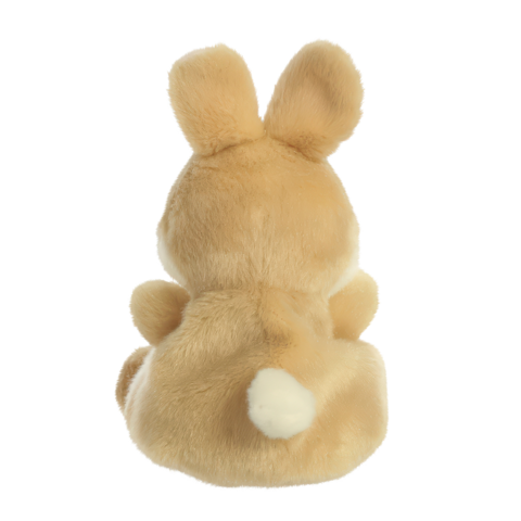 Ein flauschiger Hase von hinten, mit runden Ohren und einem kleinen weißen Puschelschwanz.