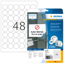 Ein Blatt mit ablösbaren Etiketten, nummeriert mit 48, und eine Verpackung mit der Aufschrift "Außer Betrieb. Out of order."