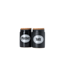 Zwei schwarze Gewürzgläser mit Korkdeckeln, beschriftet mit "Pfeffer" und "Salz".