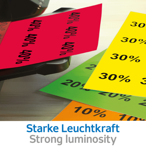 Bunte Rabattkarten in verschiedenen Farben mit Prozentangaben, darunter 10%, 20%, 30% und 40%, auf einem Tisch platziert.