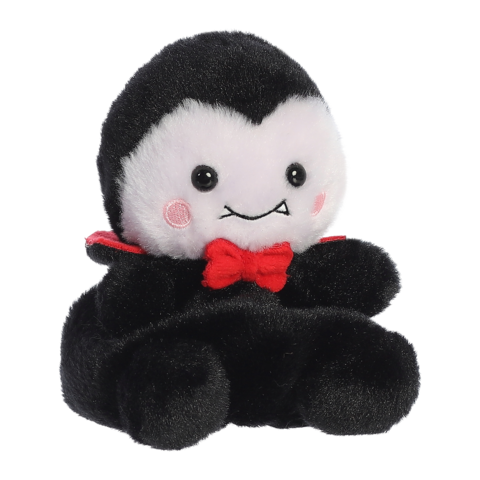 Kuscheltier in Form eines Vampirs mit schwarzem Umhang und roter Schleife, einem freundlichen Gesicht und runden Wangen."
(Note: The original text is already in German and does not require any changes for clarity or fluency.)