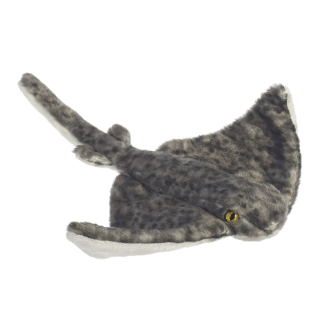 Plüschspielzeug in Form eines Wals mit grauem Fell und gelben Augen.