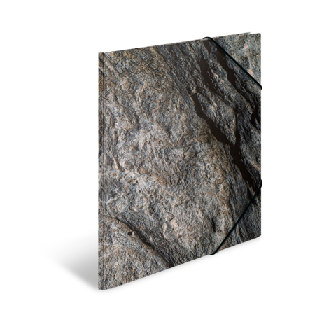 Eine strukturierte Felsoberfläche mit verschiedenen Grautönen und kleinen Rissen, die die natürliche Textur des Gesteins zeigt.