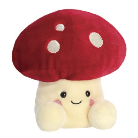 Kuscheliges Pilzplüschtier mit rotem Hut und weißen Punkten, lächelnd und mit runden, freundlichen Augen.