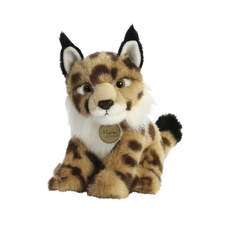 Plüschluchs mit braunem Fell und weißen Akzenten, sitzt aufrecht und schaut direkt in die Kamera. Markenetikett sichtbar.