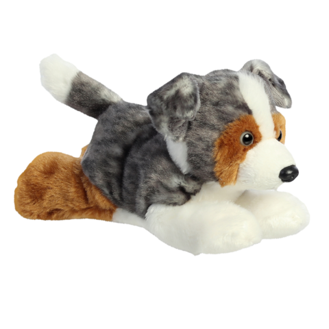 Plüschhund in liegender Position mit grauem und braunem Fell, großen Augen und einem weißen Fleck auf dem Kopf.