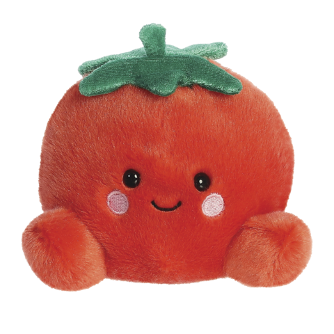 Kuscheltomate mit einem lächelnden Gesicht, runden Wangen und grünen Blättern oben. Sie hat einen weichen, roten Körper und kleine, runde Arme.