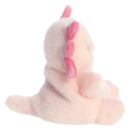Plüschfigur eines rosa Einhorns mit einer rosa Mähne, sitzend und von der Seite aus betrachtet.