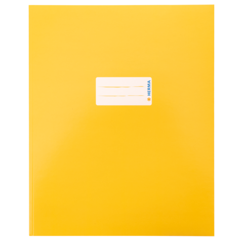 Gelbes Heft mit einem weißen Aufkleber in der Mitte, auf dem "HERMA" steht.