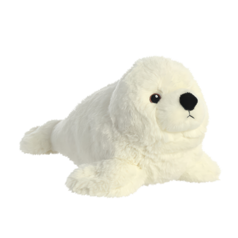 Plüschrobbe in Weiß mit schwarzen Augen und Nase, liegend auf einer flachen Oberfläche.